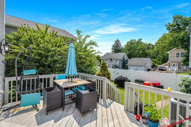 76 Woodland Dr, Keyport, NJ 07735 - deck with a fenced backyard, outdoor dining area, and central AC