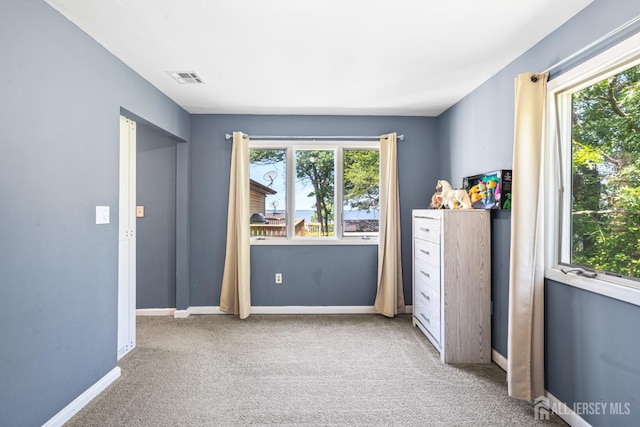 76 Woodland Dr, Keyport, NJ 07735 - unfurnished bedroom featuring multiple windows, carpet floors, and baseboards