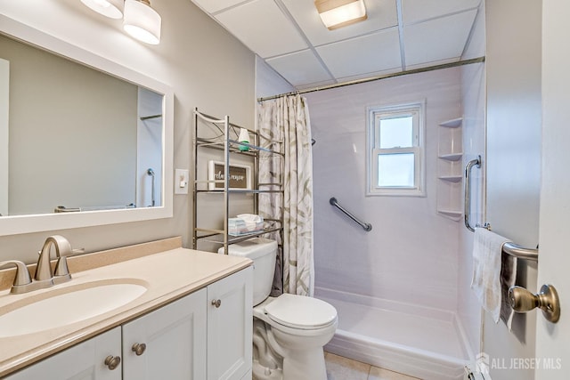 full bathroom featuring curtained shower, vanity, toilet, and tile patterned floors