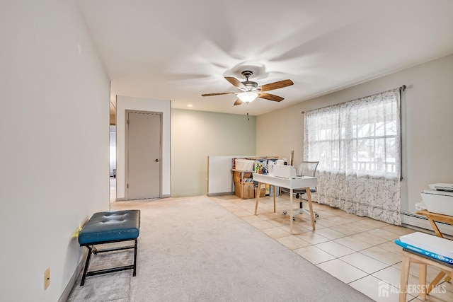 tiled home office featuring a baseboard radiator, carpet flooring, and a ceiling fan