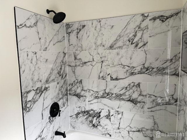 interior space featuring shower / tub combination