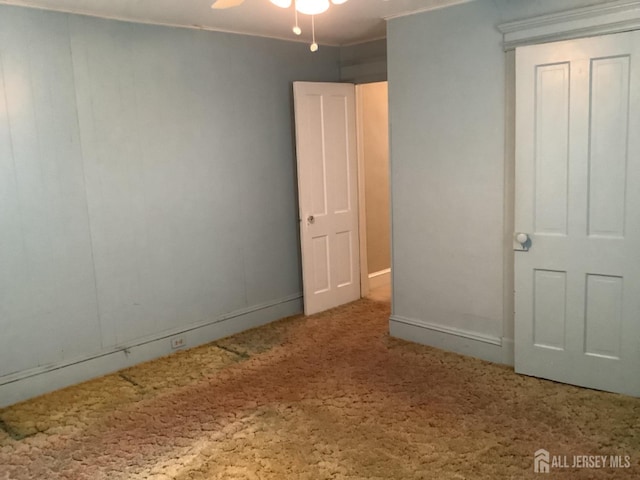 unfurnished bedroom featuring ornamental molding and carpet