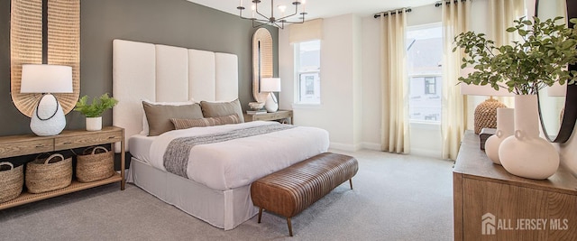 1313 Parker Blvd, West Windsor, NJ 08550 - bedroom featuring carpet floors, baseboards, and a chandelier