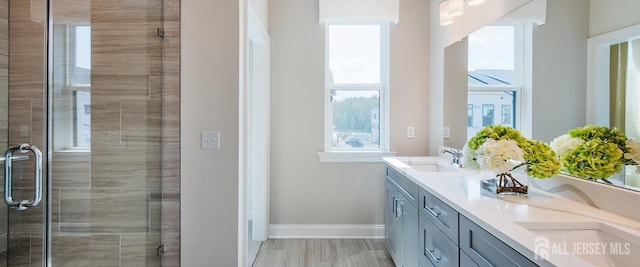 1313 Parker Blvd, West Windsor, NJ 08550 - bathroom featuring double vanity, baseboards, and a shower stall