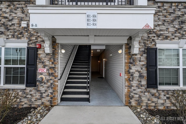 view of exterior entry with stone siding