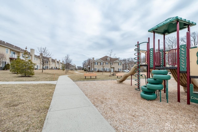 community jungle gym with a residential view