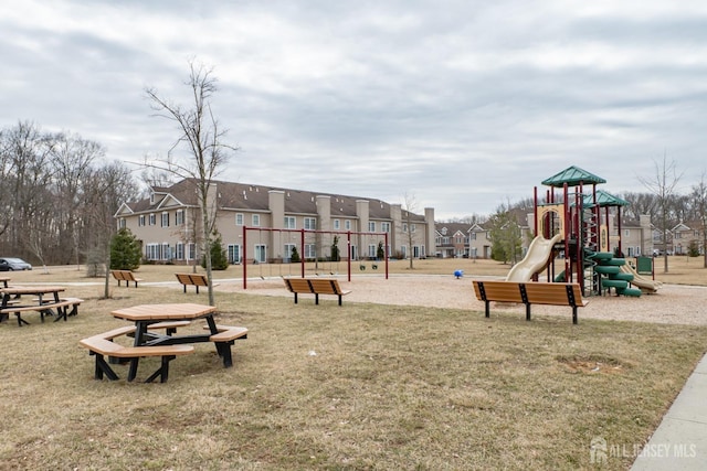 community playground with a residential view and a yard