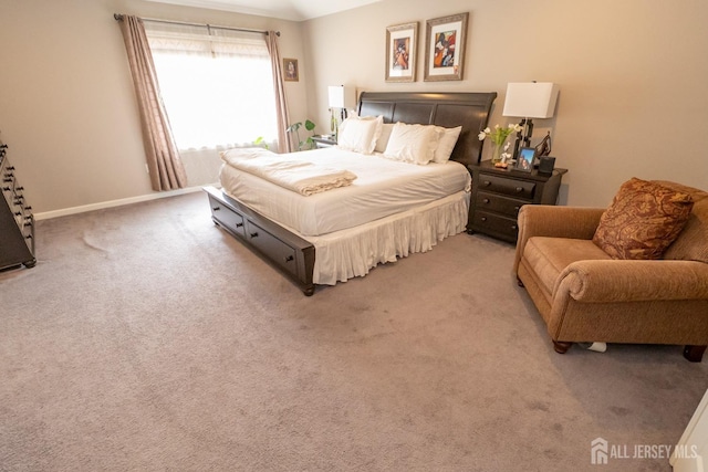 carpeted bedroom with baseboards