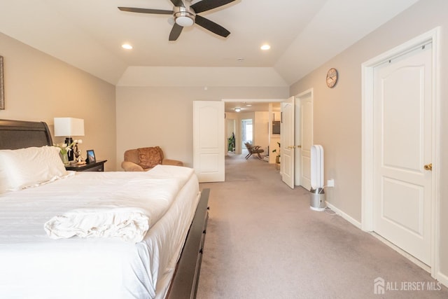 bedroom with lofted ceiling, recessed lighting, baseboards, and light colored carpet