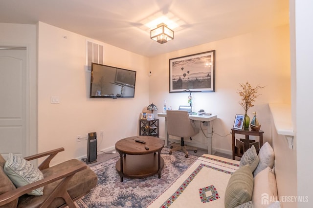 home office with baseboards and visible vents