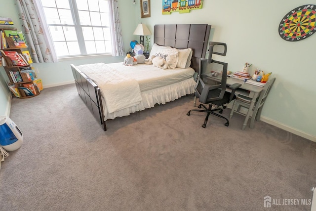 bedroom with baseboards and carpet flooring