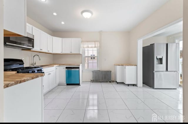 5 Warren St, Jamesburg, NJ 08831 - kitchen with stainless steel refrigerator with ice dispenser, radiator, dishwashing machine, gas range oven, and light marble finish floors