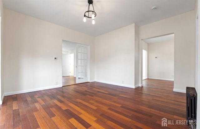 5 Warren St, Jamesburg, NJ 08831 - unfurnished room with wood-type flooring and a smoke detector