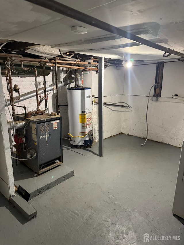5 Warren St, Jamesburg, NJ 08831 - unfinished basement featuring gas water heater and a heating unit