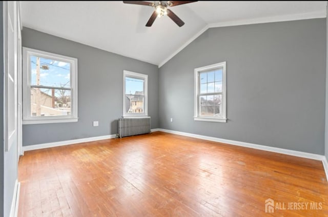 5 Warren St, Jamesburg, NJ 08831 - spare room featuring radiator, healthy amount of natural light, ceiling fan, hardwood / wood-style floors, and lofted ceiling