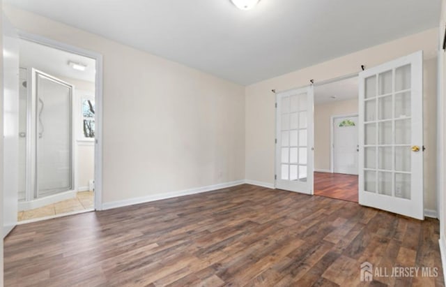 5 Warren St, Jamesburg, NJ 08831 - unfurnished room featuring french doors and wood finished floors