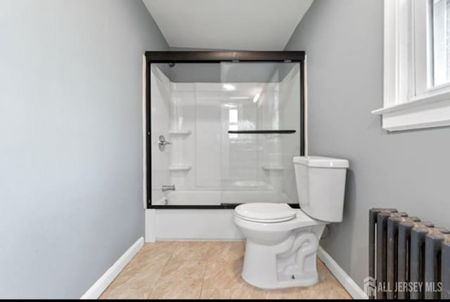 5 Warren St, Jamesburg, NJ 08831 - bathroom featuring radiator heating unit, shower / bath combination with glass door, and tile patterned flooring