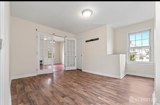 5 Warren St, Jamesburg, NJ 08831 - empty room featuring french doors and wood finished floors