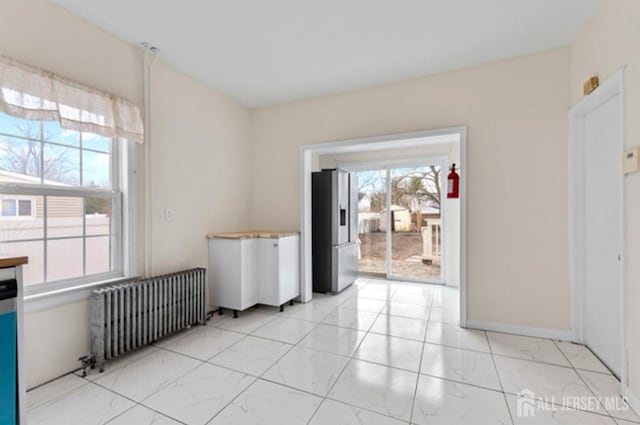 5 Warren St, Jamesburg, NJ 08831 - empty room with radiator and light marble finish flooring