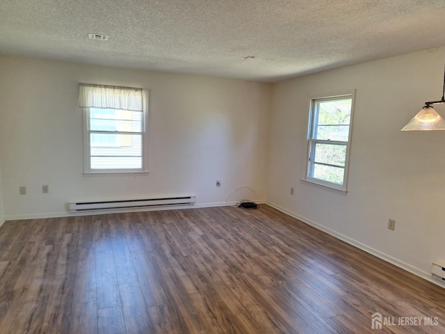 empty room featuring a baseboard radiator, a textured ceiling, dark wood-style flooring, and baseboards