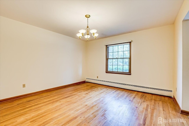730 Old Post Rd, Edison, NJ 08817 - unfurnished room with baseboard heating, light wood finished floors, and a chandelier