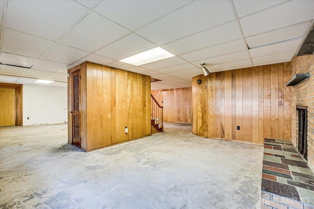 730 Old Post Rd, Edison, NJ 08817 - finished below grade area featuring stairs, a fireplace, wood walls, and a paneled ceiling