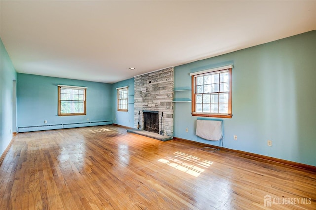 730 Old Post Rd, Edison, NJ 08817 - unfurnished living room with a baseboard heating unit, wood finished floors, and a fireplace