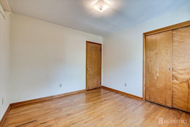 730 Old Post Rd, Edison, NJ 08817 - unfurnished bedroom with light wood-style flooring and a closet