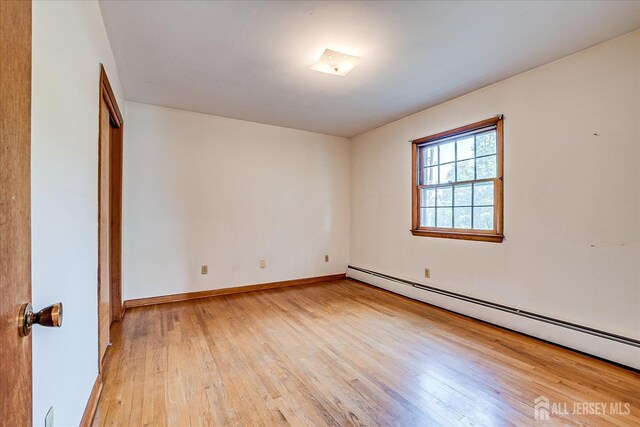 730 Old Post Rd, Edison, NJ 08817 - spare room with baseboard heating and light wood finished floors