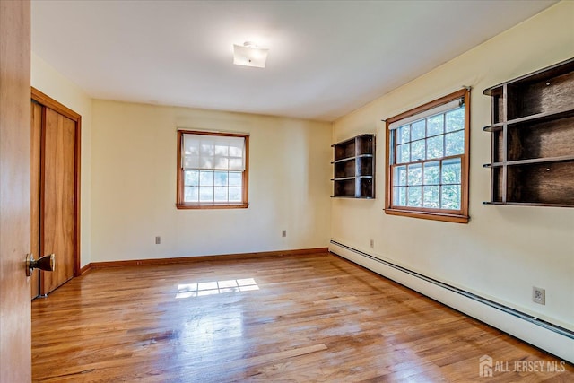 730 Old Post Rd, Edison, NJ 08817 - unfurnished room with a baseboard radiator and wood finished floors