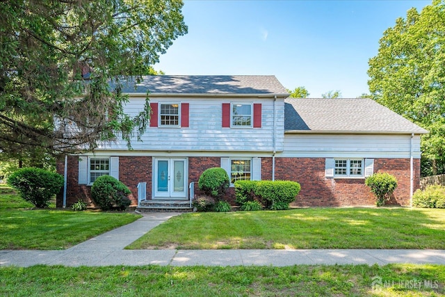 730 Old Post Rd, Edison, NJ 08817 - colonial house with a front lawn, french doors, brick siding, and roof with shingles
