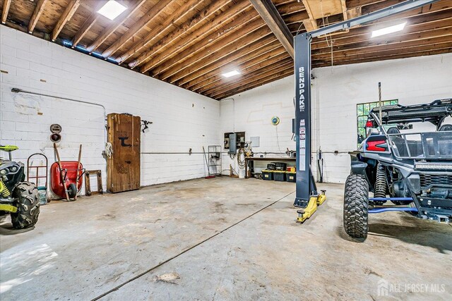 730 Old Post Rd, Edison, NJ 08817 - garage with concrete block wall and electric panel
