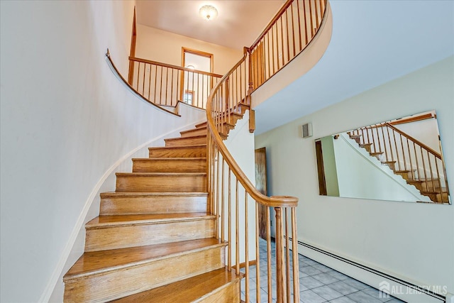 730 Old Post Rd, Edison, NJ 08817 - staircase featuring a baseboard heating unit and tile patterned floors