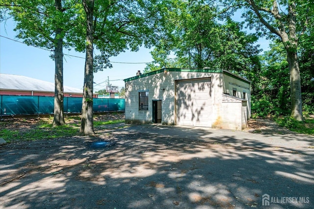 730 Old Post Rd, Edison, NJ 08817 - view of outdoor structure featuring asphalt driveway