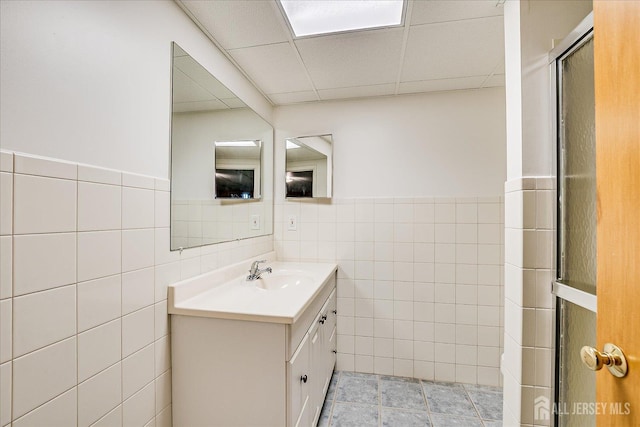 730 Old Post Rd, Edison, NJ 08817 - full bathroom with tile walls, vanity, a drop ceiling, wainscoting, and a shower with shower door