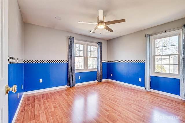 47 Lynnwood Rd, Edison, NJ 08820 - empty room with wood finished floors, a ceiling fan, and baseboards