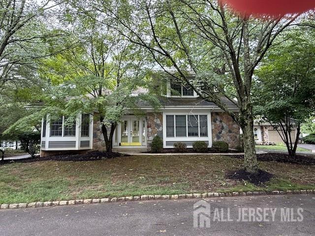 1 Cranberry Ct, South Brunswick, NJ 08540 - obstructed view of property featuring stone siding and french doors