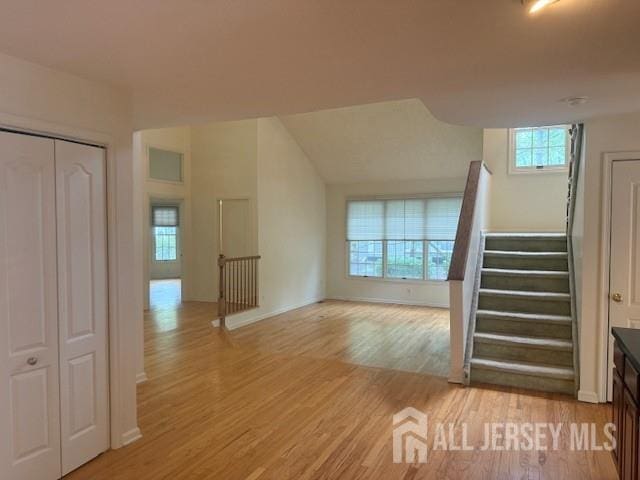 1 Cranberry Ct, South Brunswick, NJ 08540 - unfurnished living room with light wood-type flooring and stairs