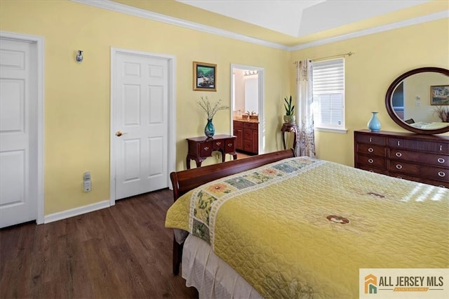 bedroom with ornamental molding, baseboards, and wood finished floors