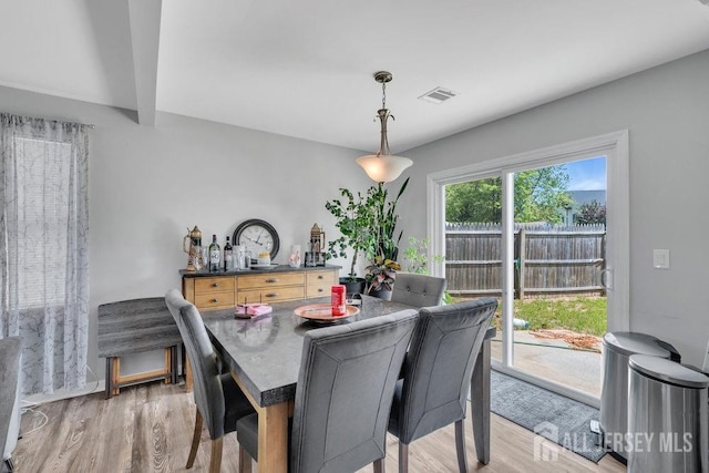 33 Altamont Rd, Edison, NJ 08817 - dining area featuring light wood finished floors and beam ceiling
