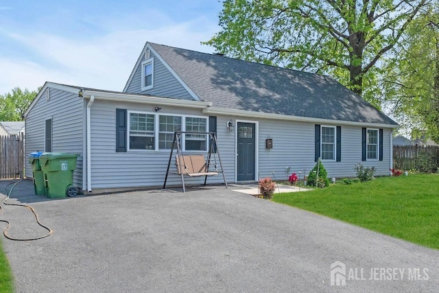 33 Altamont Rd, Edison, NJ 08817 - view of front of home with a shingled roof and a patio area
