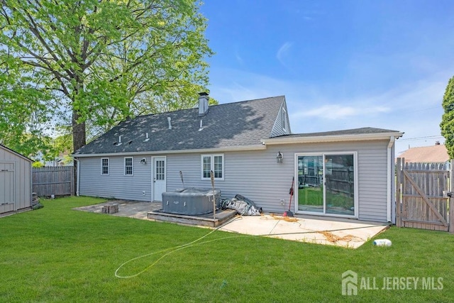 33 Altamont Rd, Edison, NJ 08817 - rear view of property with a patio, a hot tub, a gate, and a shingled roof