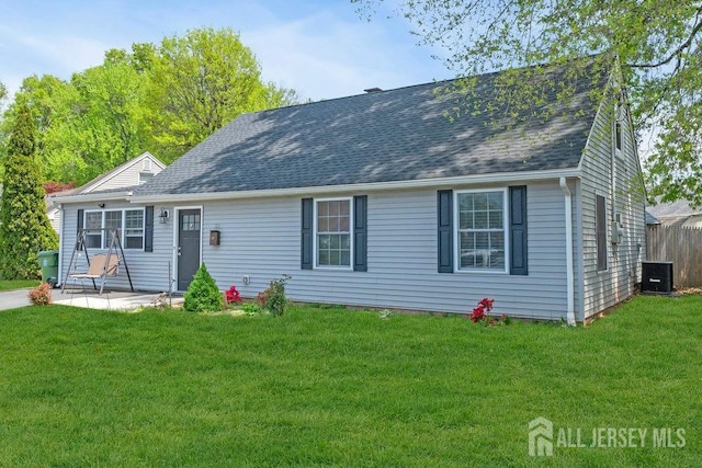 33 Altamont Rd, Edison, NJ 08817 - view of front facade with central air condition unit, a patio, a front lawn, and a shingled roof