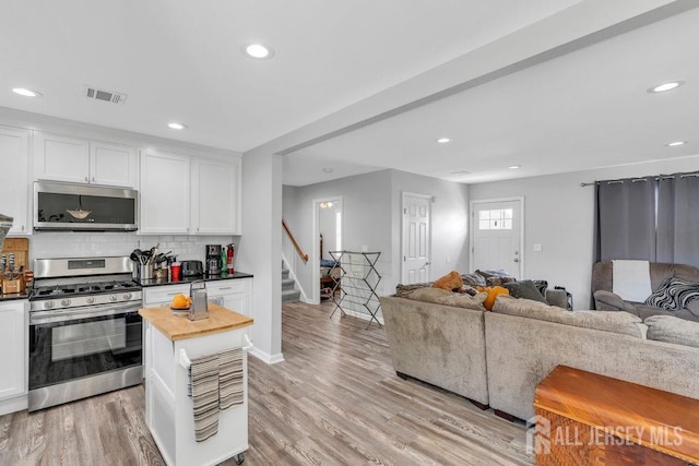 33 Altamont Rd, Edison, NJ 08817 - kitchen featuring stainless steel appliances, open floor plan, white cabinetry, and recessed lighting