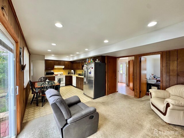 2 Jayne St, Old Bridge, NJ 08857 - living room featuring recessed lighting and wood walls