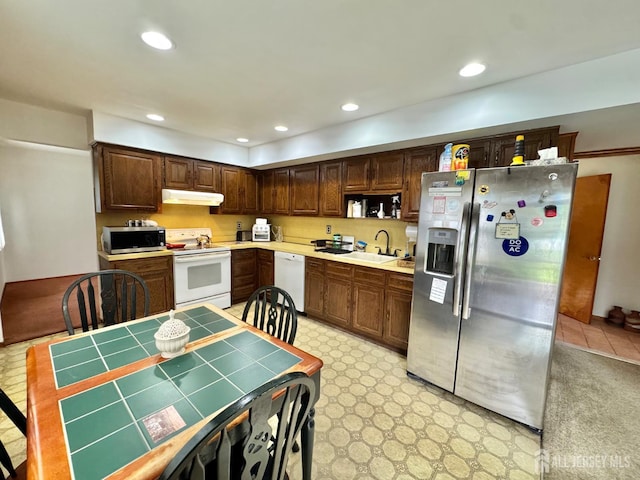 2 Jayne St, Old Bridge, NJ 08857 - kitchen with appliances with stainless steel finishes, under cabinet range hood, a sink, dark brown cabinets, and recessed lighting
