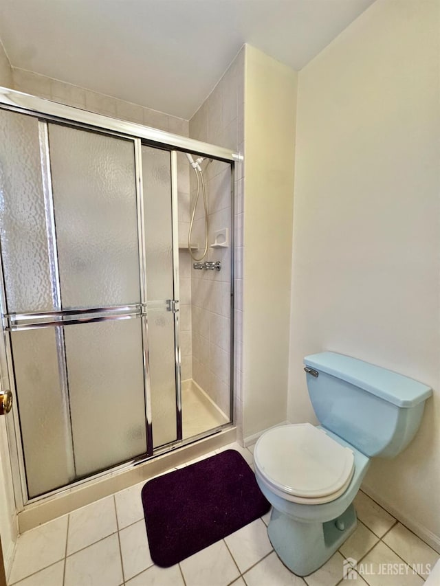 2 Jayne St, Old Bridge, NJ 08857 - bathroom with toilet, a shower stall, and tile patterned floors