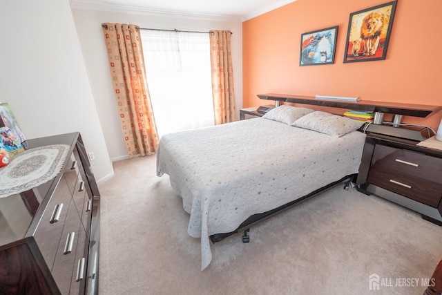 bedroom featuring light colored carpet and crown molding