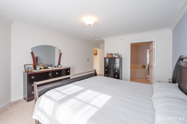 bedroom with ornamental molding, light carpet, and connected bathroom