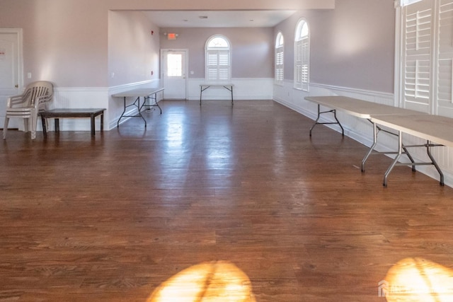 unfurnished living room with dark hardwood / wood-style floors